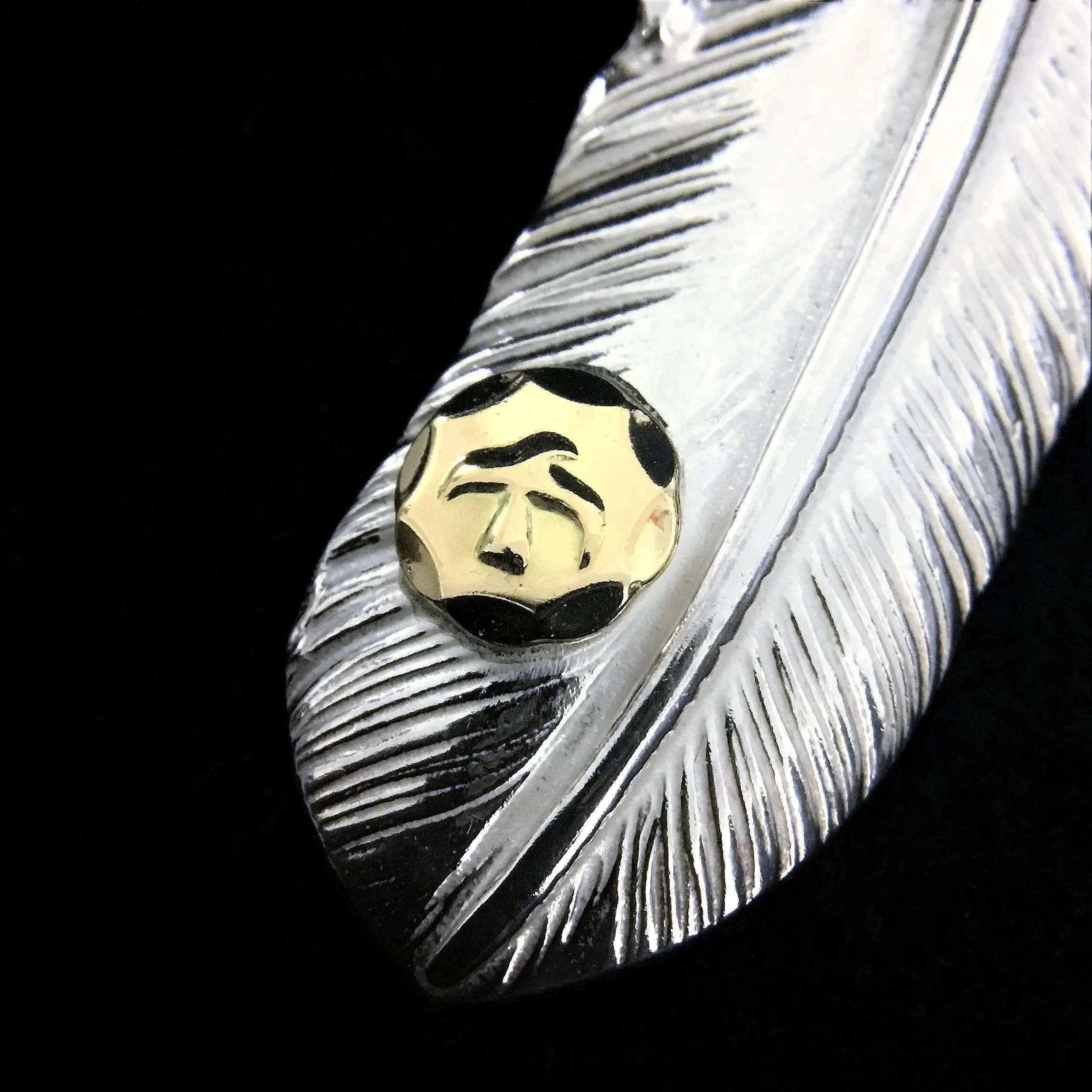 Goros Feather With Silver Claw - Facing Right